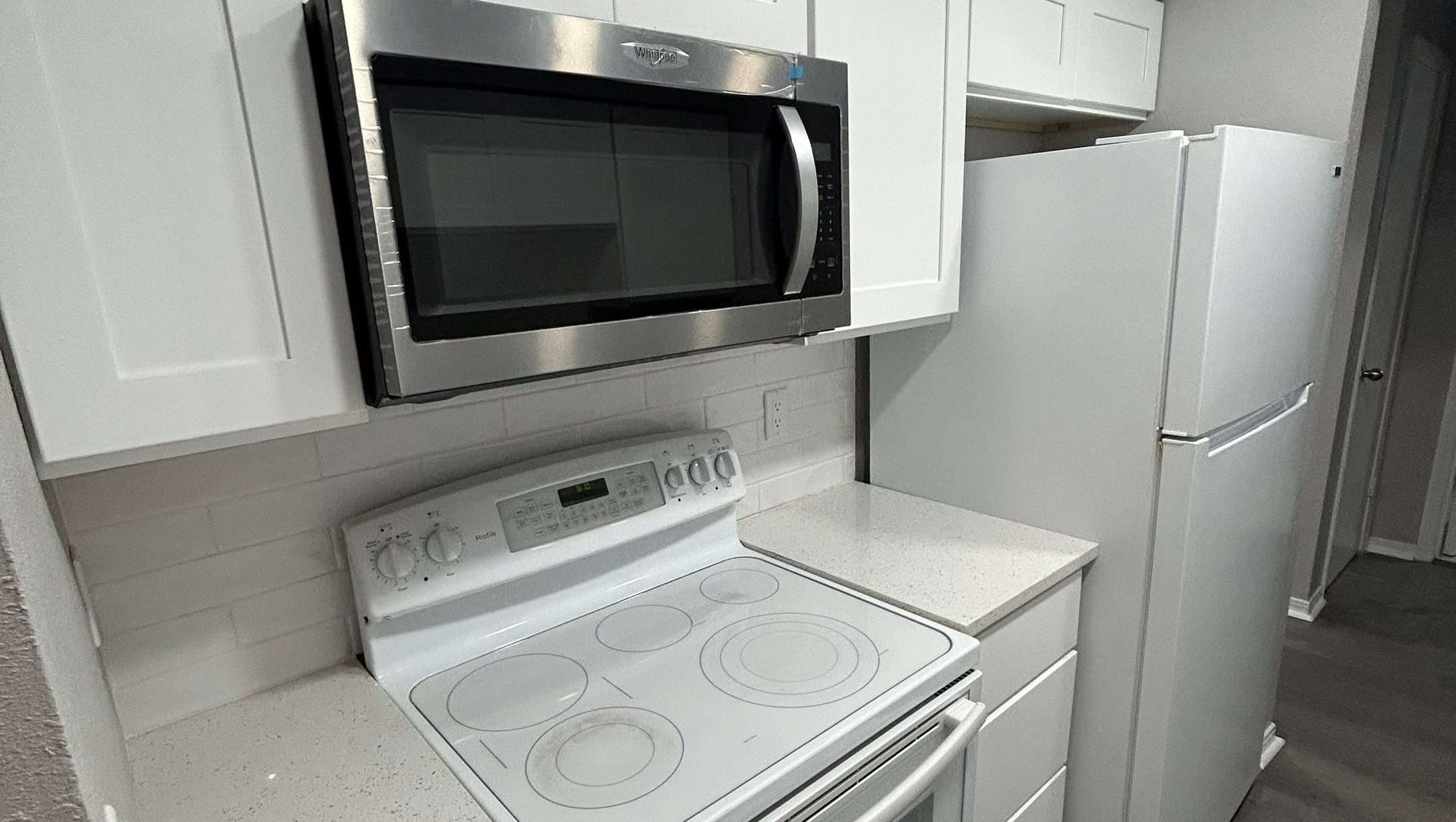 This kitchen renovation near by Urban Green Energy Remodeling includes brand-new appliances, upgraded cabinets, and a modern aesthetic for improved functionality and style.
